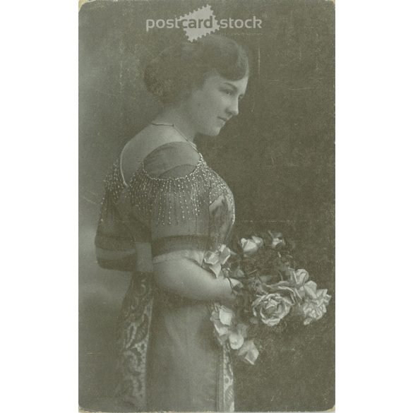 Unknown young lady, in elegant attire. The author of the picture is unknown. Original paper image. Black and white photo, old postcard. (2793859)