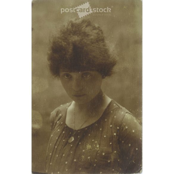 Photo of a young girl. The people in the photo and the photographer are unknown. Original old photo. Black and white photo card, old postcard. (2793887)