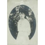 Photo of a young girl with a bow. The person in the photo and the photographer are unknown. Original old photo. Black and white photo, original paper image. (2793892)