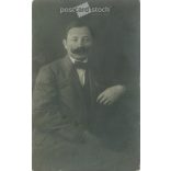 1912 - Studio photo of a middle-aged man. The person in the photo and the photographer are unknown. Original old photo, gelatin silver. Black and white photo plate, old postcard. (2793894)