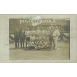 Photo of a football team. The people in the photo and the photographer are unknown. Original photo. Black and white photo card, old postcard. (2793895)