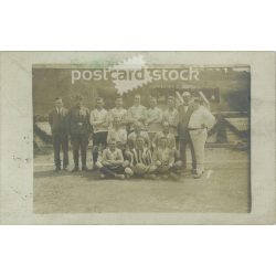   Photo of a football team. The people in the photo and the photographer are unknown. Original photo. Black and white photo card, old postcard. (2793895)